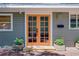 Close-up showcasing the home's front door, complete with stylish planters and a brick walkway at 1739 Oak St, Sarasota, FL 34236