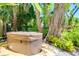 Outdoor hot tub nestled among tropical landscaping, offering a private and serene relaxation space at 1739 Oak St, Sarasota, FL 34236