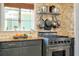 This kitchen has granite countertops, stainless steel appliances, and a pot rack at 1739 Oak St, Sarasota, FL 34236