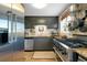 This kitchen features stainless steel appliances, granite countertops and a stainless steel range at 1739 Oak St, Sarasota, FL 34236