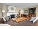 Inviting living room with a fireplace, leather sofa, and open layout at 1739 Oak St, Sarasota, FL 34236