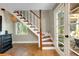 Beautiful staircase with wood and white trim and natural light at 1739 Oak St, Sarasota, FL 34236