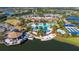 Aerial view of the community clubhouse, pool area, and lake, showcasing the resort-style amenities at 17440 Hampton Falls Ter, Bradenton, FL 34202