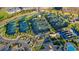 Aerial shot of multiple community tennis courts and mature landscaping showcases the many amenities at 17440 Hampton Falls Ter, Bradenton, FL 34202