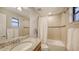 Well-lit bathroom featuring granite counters, tiled shower and tub and decorative accents at 17440 Hampton Falls Ter, Bradenton, FL 34202