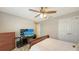 Comfortable bedroom with wood flooring, ceiling fan and bright windows at 17440 Hampton Falls Ter, Bradenton, FL 34202