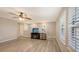 Bright bonus room featuring wood flooring, a ceiling fan and lots of natural light from the windows at 17440 Hampton Falls Ter, Bradenton, FL 34202