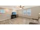 Bright bonus room featuring wood flooring, a ceiling fan and lots of natural light from the windows at 17440 Hampton Falls Ter, Bradenton, FL 34202