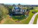 Del Webb Lakewood Ranch entrance with a serene pond, fountains, and lush landscaping welcomes residents and guests at 17440 Hampton Falls Ter, Bradenton, FL 34202