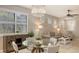 Bright dining area with a glass-top table, stylish chairs, and views of the living room, perfect for entertaining at 17440 Hampton Falls Ter, Bradenton, FL 34202