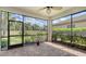 Relaxing screened patio with brick floor, panoramic views of lush landscaping, and lots of sunshine at 17440 Hampton Falls Ter, Bradenton, FL 34202
