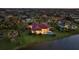 Stunning aerial view of waterfront home with private pool and lush landscaping at 1819 97Th Nw St, Bradenton, FL 34209