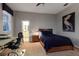 Neutral bedroom with a modern desk, and ensuite bathroom for added convenience at 1819 97Th Nw St, Bradenton, FL 34209