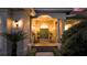 An arched entrance features stately columns, a double door, and sconce lighting at 1819 97Th Nw St, Bradenton, FL 34209