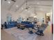 Expansive living room with comfortable seating, modern lighting, and seamless integration with the dining area at 1819 97Th Nw St, Bradenton, FL 34209