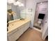 Bathroom featuring a vanity with countertop, a large mirror and a separate room for the toilet and shower at 182 Pineneedle Dr # 182, Bradenton, FL 34210