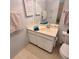 A clean bathroom featuring a sink with vanity and neutral tiling at 182 Pineneedle Dr # 182, Bradenton, FL 34210