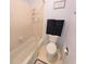 Bathroom with tile flooring and shower walls, a bathtub and a toilet at 182 Pineneedle Dr # 182, Bradenton, FL 34210
