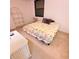 Bedroom with a bed, shelves, a white desk and carpet flooring at 182 Pineneedle Dr # 182, Bradenton, FL 34210