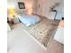 Bedroom features light-colored walls and a decorative rug on the floor at 182 Pineneedle Dr # 182, Bradenton, FL 34210