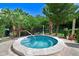 Community offers a private hot tub surrounded by lush landscaping and a cozy brick patio at 182 Pineneedle Dr # 182, Bradenton, FL 34210