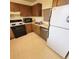 A full kitchen includes an oven, microwave, dishwasher, and refrigerator at 182 Pineneedle Dr # 182, Bradenton, FL 34210