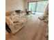 Cozy living room with a glass coffee table and comfortable seating, perfect for relaxation and gatherings at 182 Pineneedle Dr # 182, Bradenton, FL 34210