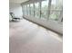 Enjoy this airy sunroom with many windows and a relaxing chair, creating a tranquil space to enjoy the views at 182 Pineneedle Dr # 182, Bradenton, FL 34210