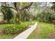 Community features scenic walking paths through mature trees, creating a peaceful and relaxing environment at 182 Pineneedle Dr # 182, Bradenton, FL 34210