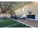 Large community gym with modern fitness equipment and an indoor sports area at 18312 Thistleberry Pl, Lakewood Ranch, FL 34211