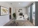 Well-lit home office with a modern desk, comfortable chair, and ample storage space at 18312 Thistleberry Pl, Lakewood Ranch, FL 34211