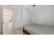 Bright bedroom with closet and doorway to hallway at 2015 Bolsena St, Nokomis, FL 34275