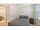 Bedroom featuring a comfortable bed, nightstand, and closet at 2015 Bolsena St, Nokomis, FL 34275