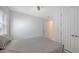 A simple yet comfortable bedroom with a large window, closet, and neutral decor at 2015 Bolsena St, Nokomis, FL 34275