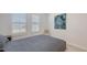 Bright bedroom featuring a comfortable bed, chair, and natural light at 2015 Bolsena St, Nokomis, FL 34275