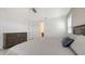 A bedroom featuring a dresser and a door that leads to the bathroom at 2015 Bolsena St, Nokomis, FL 34275