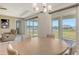 Comfortable dining area with ample natural light and views of the serene surroundings at 2015 Bolsena St, Nokomis, FL 34275