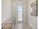 Bright entryway featuring a decorative table and front door at 2015 Bolsena St, Nokomis, FL 34275