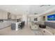 Open living room featuring tile floors, an island, and stainless steel appliances at 2015 Bolsena St, Nokomis, FL 34275