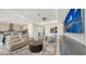 Expansive living room with sleek finishes and an open layout connecting to the kitchen area at 2015 Bolsena St, Nokomis, FL 34275
