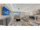 Open-concept living room with modern furnishings and a seamless transition to the kitchen at 2015 Bolsena St, Nokomis, FL 34275