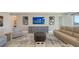 Cozy living room featuring stylish furniture, modern art, and ample natural light at 2015 Bolsena St, Nokomis, FL 34275
