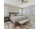 Comfortable main bedroom featuring a ceiling fan, natural light, and an en-suite bathroom at 2015 Bolsena St, Nokomis, FL 34275