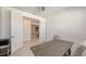 Bright home office with white walls, modern desk and seating for two at 2015 Bolsena St, Nokomis, FL 34275