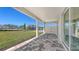 This patio offers a brick floor, a ceiling, and views of the green lawn at 2015 Bolsena St, Nokomis, FL 34275