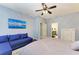 Tranquil bedroom featuring a comfortable seating area, en-suite bathroom and modern decor at 205 Shell Creek Ct, Apollo Beach, FL 33572