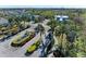 Scenic entrance into a gated community with lush landscaping and beautiful flowers at 205 Shell Creek Ct, Apollo Beach, FL 33572