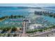 Breathtaking aerial view of the marina, the city, and the water, set against a backdrop of clear, blue skies and puffy clouds at 2105 Hibiscus St, Sarasota, FL 34239
