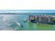 Panoramic aerial view of waterfront with coastal condo buildings and tropical foliage under a clear blue sky at 2105 Hibiscus St, Sarasota, FL 34239