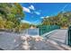 A charming green bridge spans a tranquil pond, inviting residents to enjoy the picturesque community at 2105 Hibiscus St, Sarasota, FL 34239